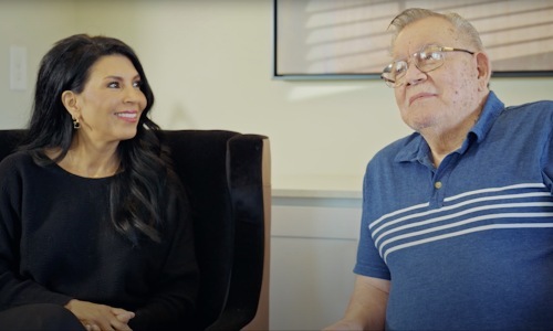 a couple of people sitting near each other